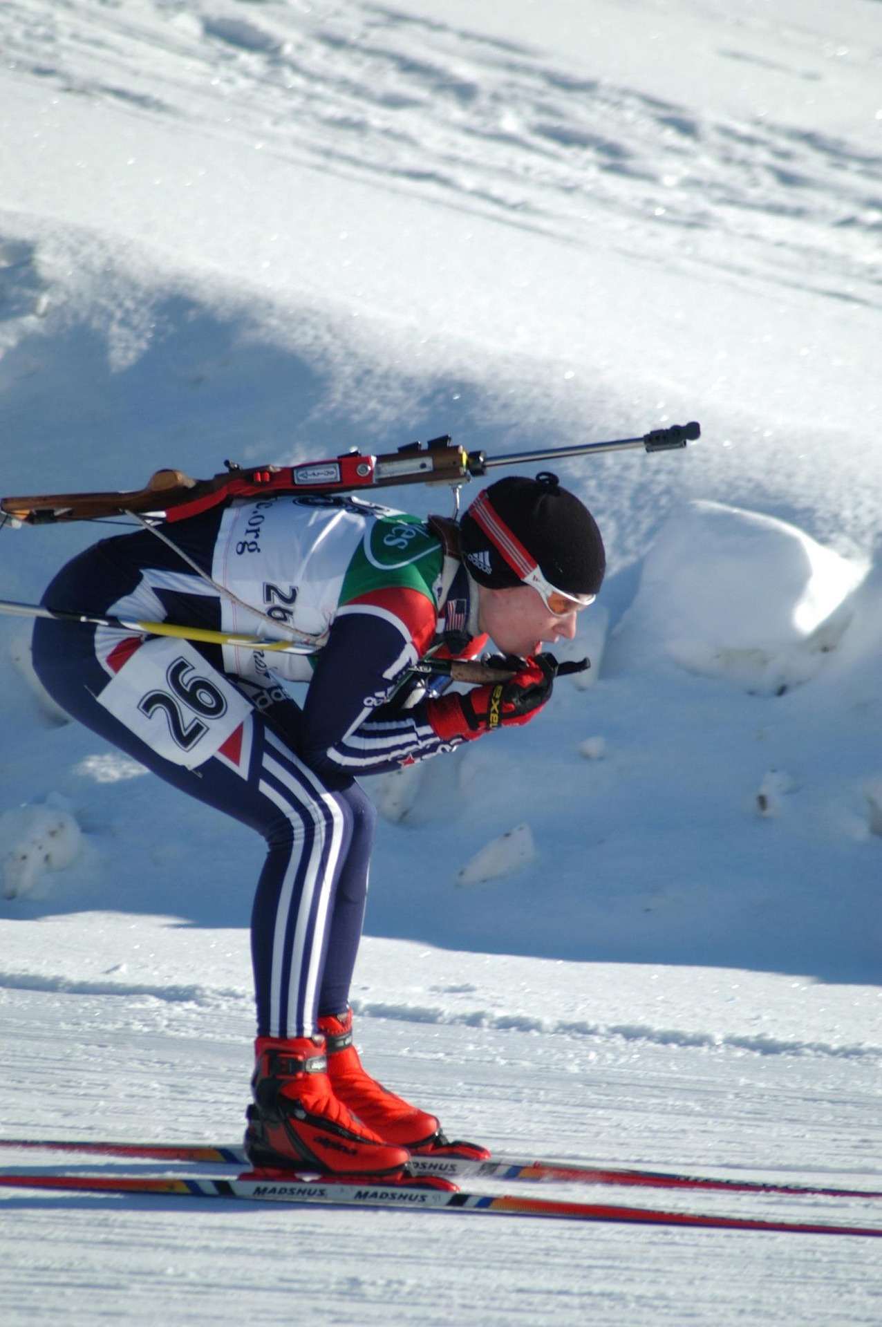 Olympic skier racing down a snowy mountain slope