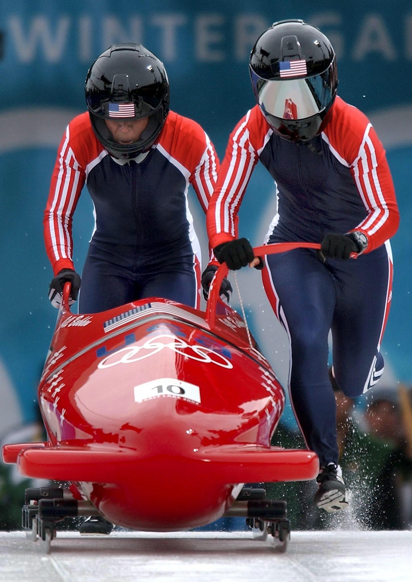 USA bobsled team pushing off at the start of a Winter Olympics run